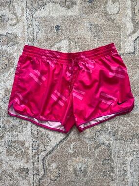 Nike Women's Bright Pink Athletic Shorts with Subtle Stripe Detail